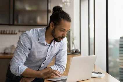 Young Man Looking At Computer