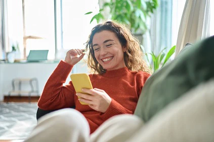 Young Smiling Woman At Home