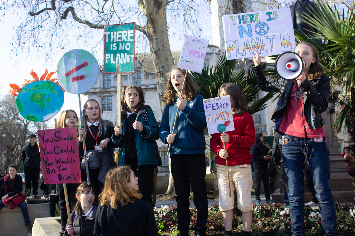 Children protesting with banners and flags