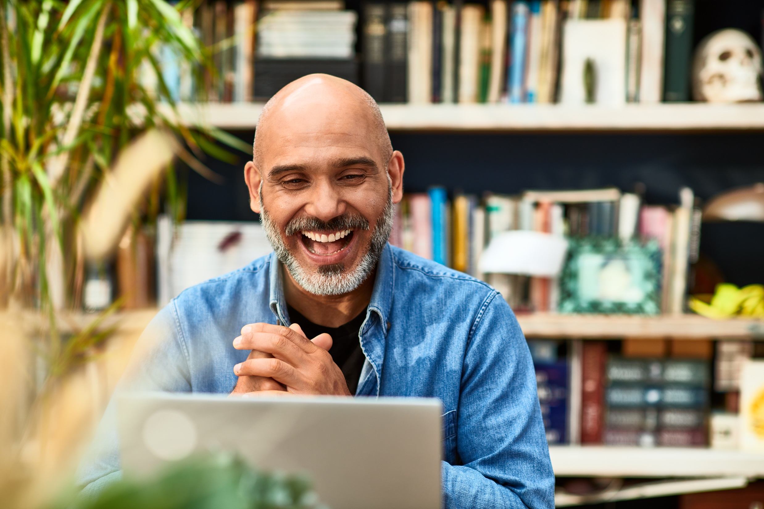 Man Attending A Webinar On His Laptop