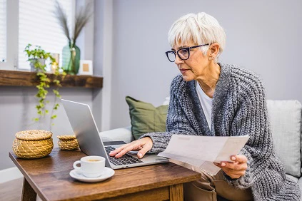 Retired Lady Looking At Bills