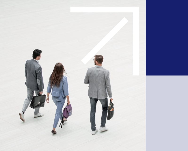 Man leaning over rail in office