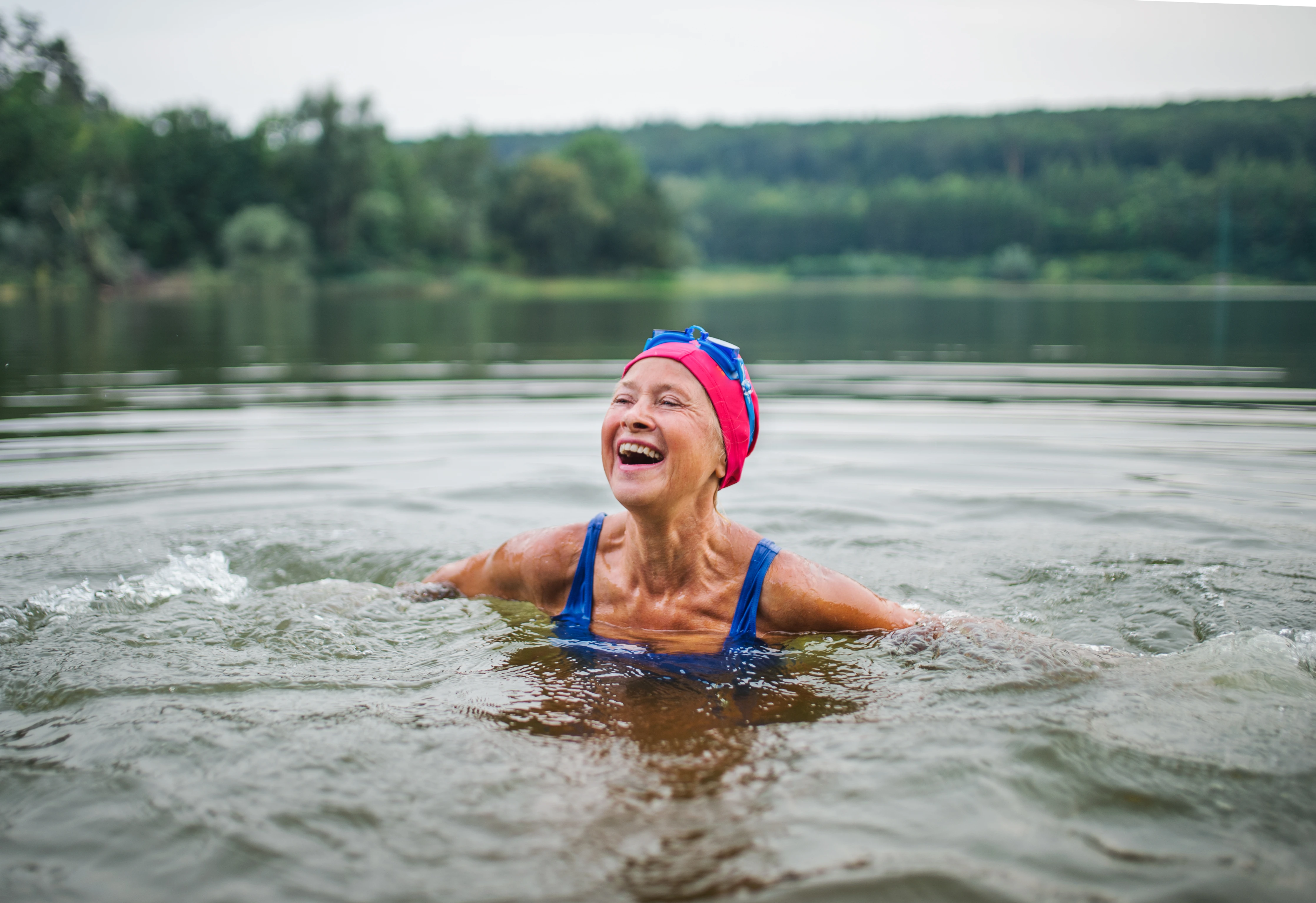 Retired lady swimming in a lake