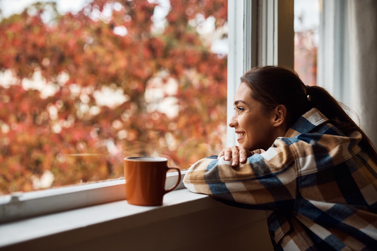 Relaxed woman looking out window