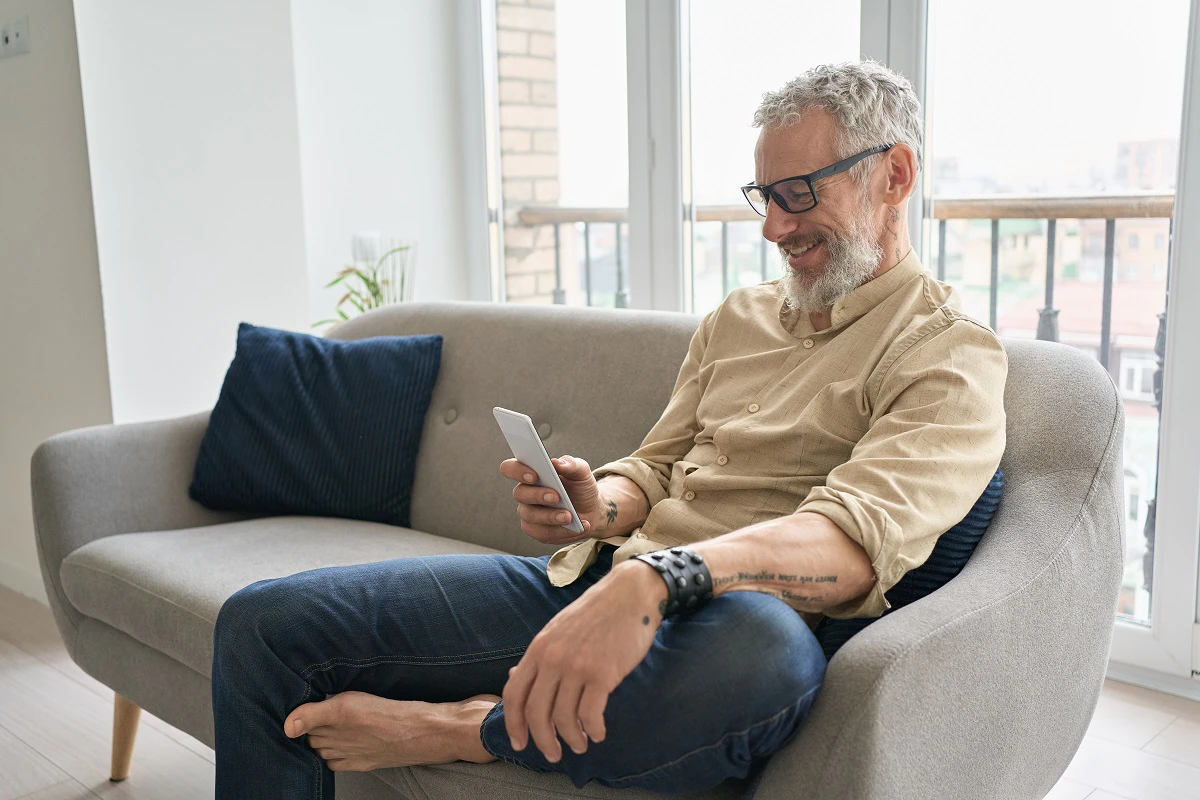 Older Man Relaxing On Sofa