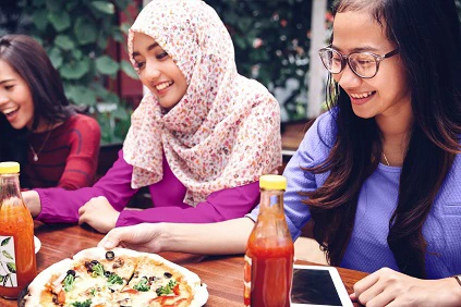 Young Muslim Woman Eating Lunch 