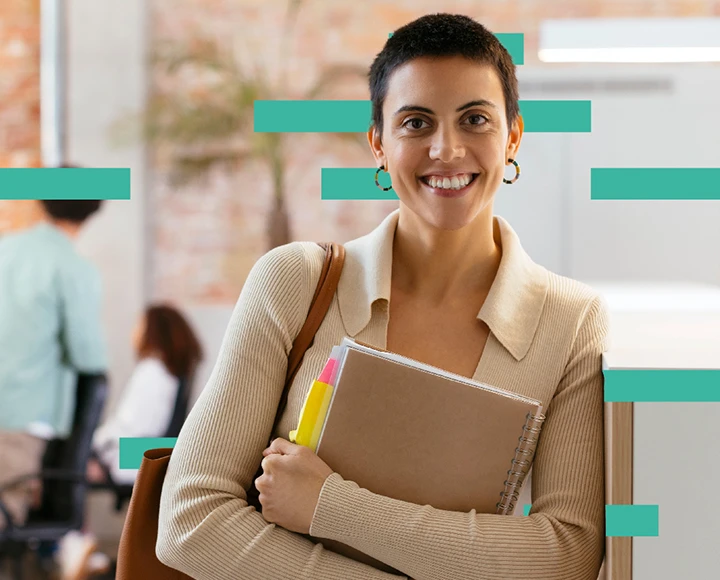 Lady holding book smiling