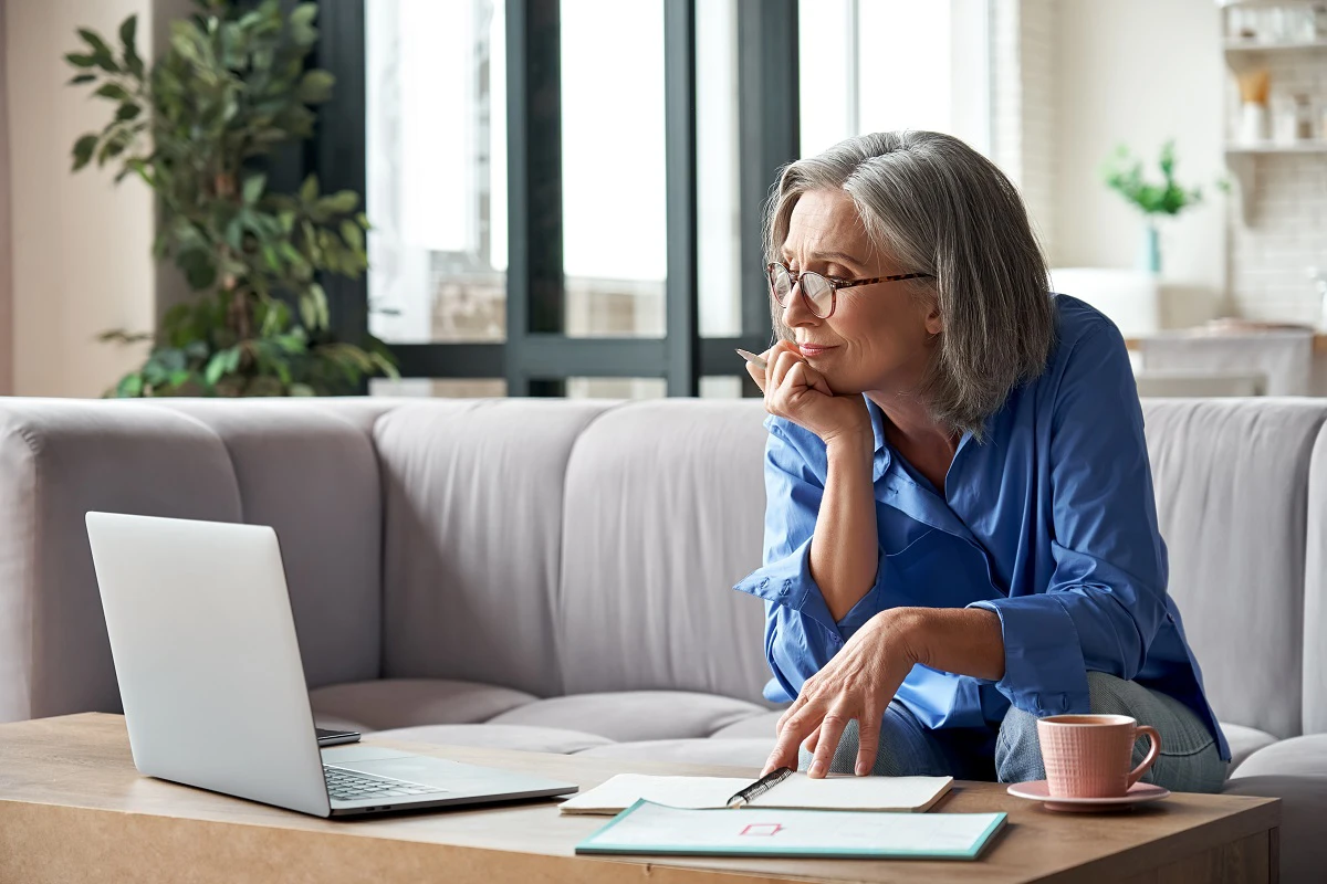 Retired Woman Looking At Computer