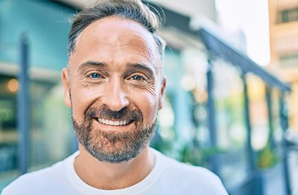 Man smiling outdoors