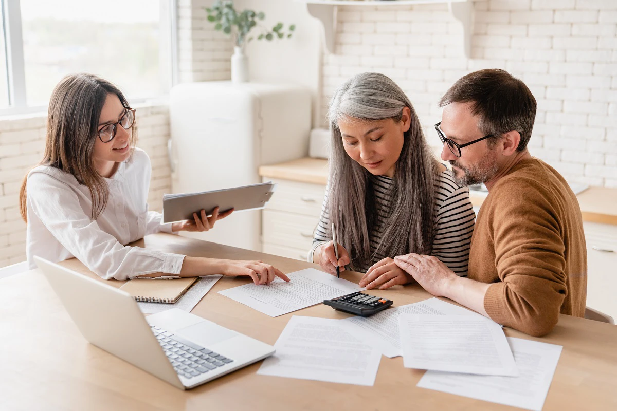 Couple Talking To Financial Adviser