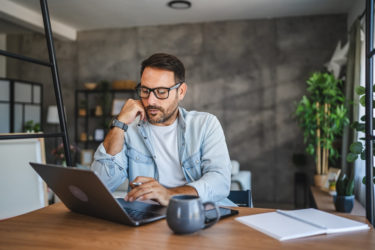 Man at home checking finances