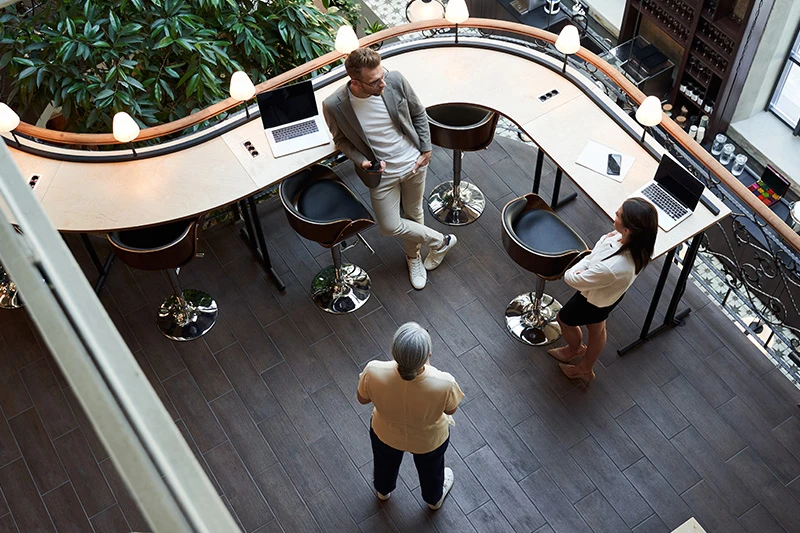 Colleagues talking in atrium