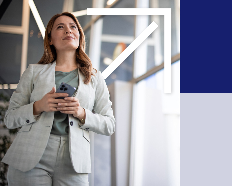 Lady holding a phone in office atrium
