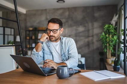 Man at home checking finances