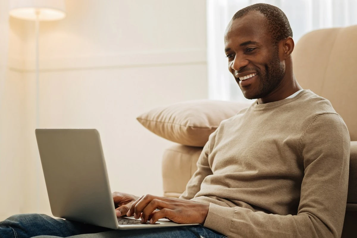 Middle Aged Man Looking At Laptop