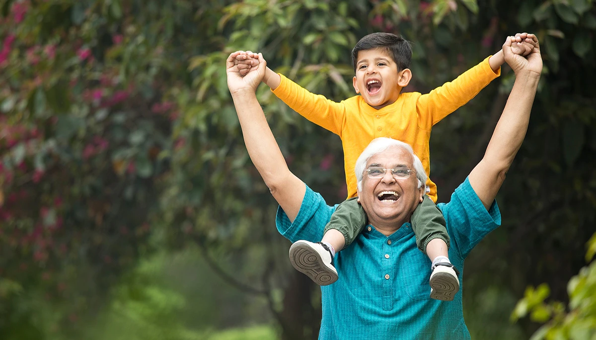 Grandad with grandson on his shoulders