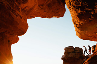 Two walkers in a canyon