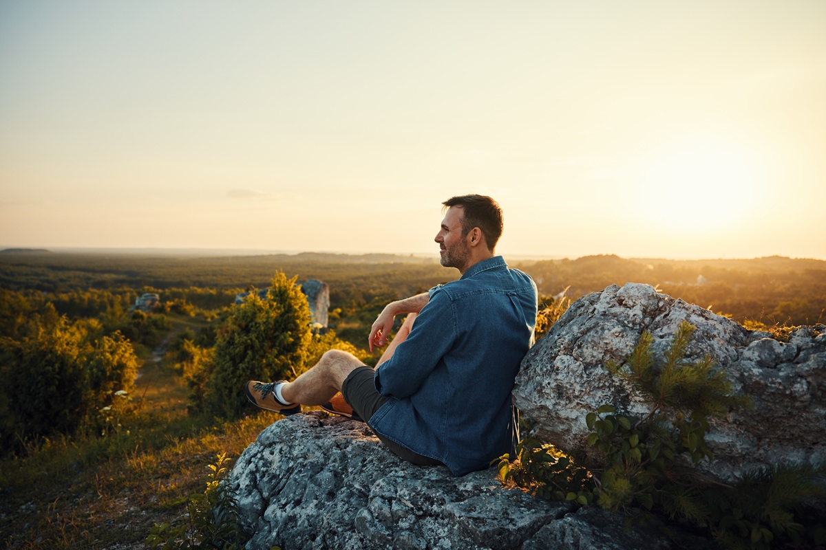 Man pausing to take in the scenery on a hike