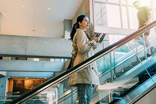 Woman on escalator