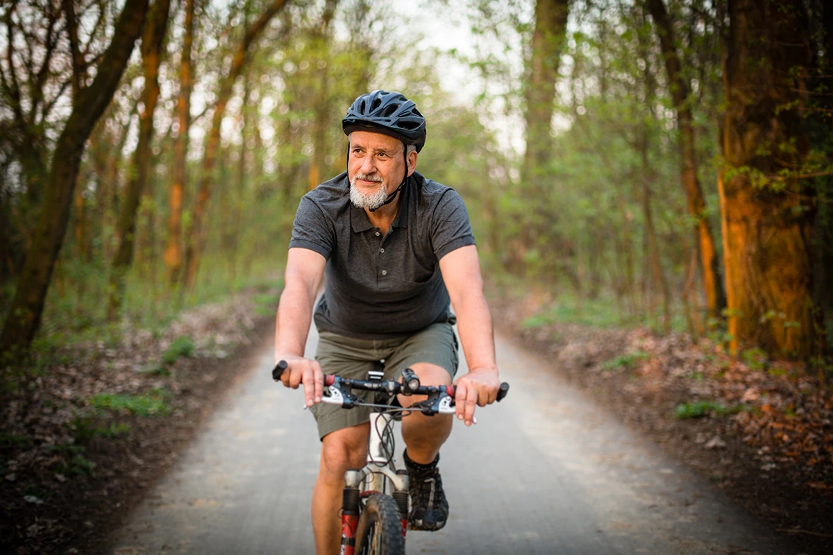 Man riding a bike in the woods