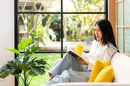 Young Woman Relaxing On Sofa