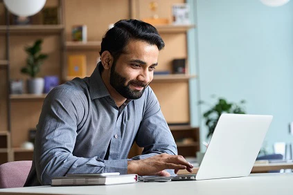 Young Man checking laptop